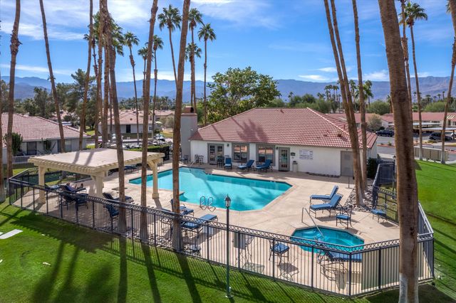 a view of a swimming pool with a garden