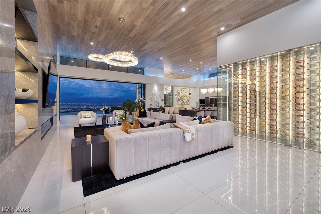 611 Cityview Ridge Drive Henderson, NV 89012 - Photo 7 of 66 Gleaming tile floors and a wood-paneled ceiling elevate this open-concept living space.