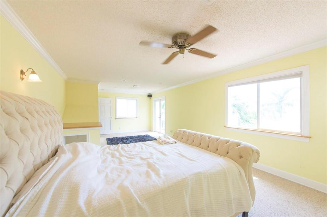 3405 Leigh Road Pompano Beach, FL 33062 - Photo 18 of 35 a bedroom with a bed and a window