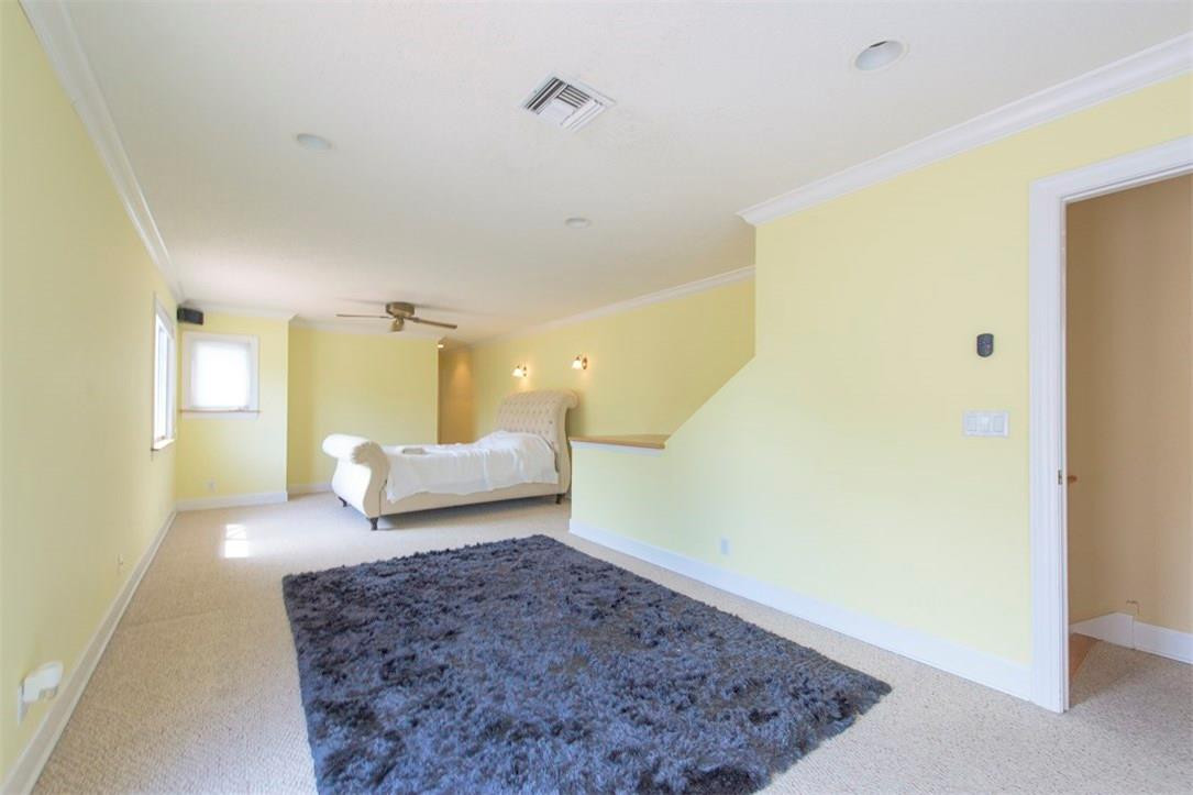 3405 Leigh Road Pompano Beach, FL 33062 - Photo 19 of 35 a spacious bedroom with a bed and a couch