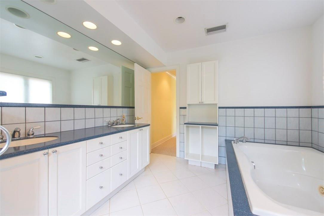 3405 Leigh Road Pompano Beach, FL 33062 - Photo 21 of 35 a bathroom with a bathtub and a sink