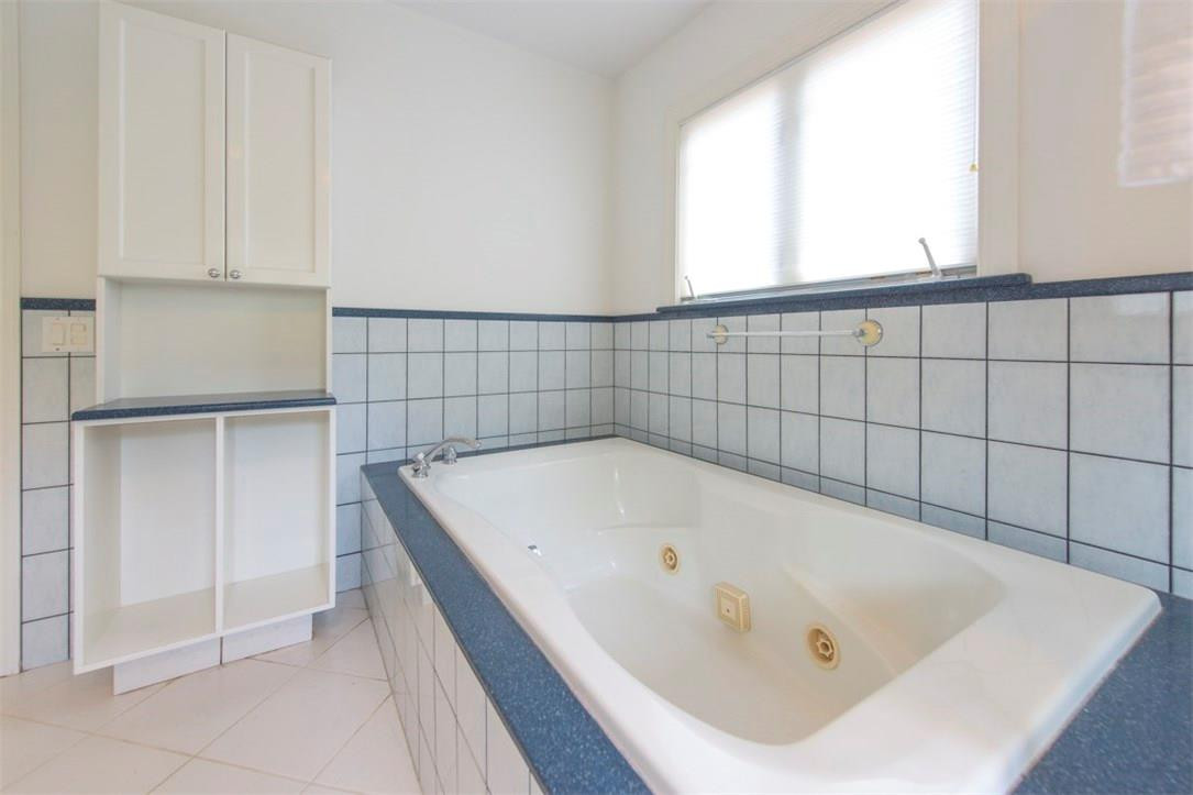 3405 Leigh Road Pompano Beach, FL 33062 - Photo 22 of 35 a bathroom with a tub