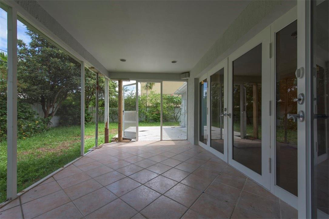 3405 Leigh Road Pompano Beach, FL 33062 - Photo 28 of 35 a view of a room with porch and a yard