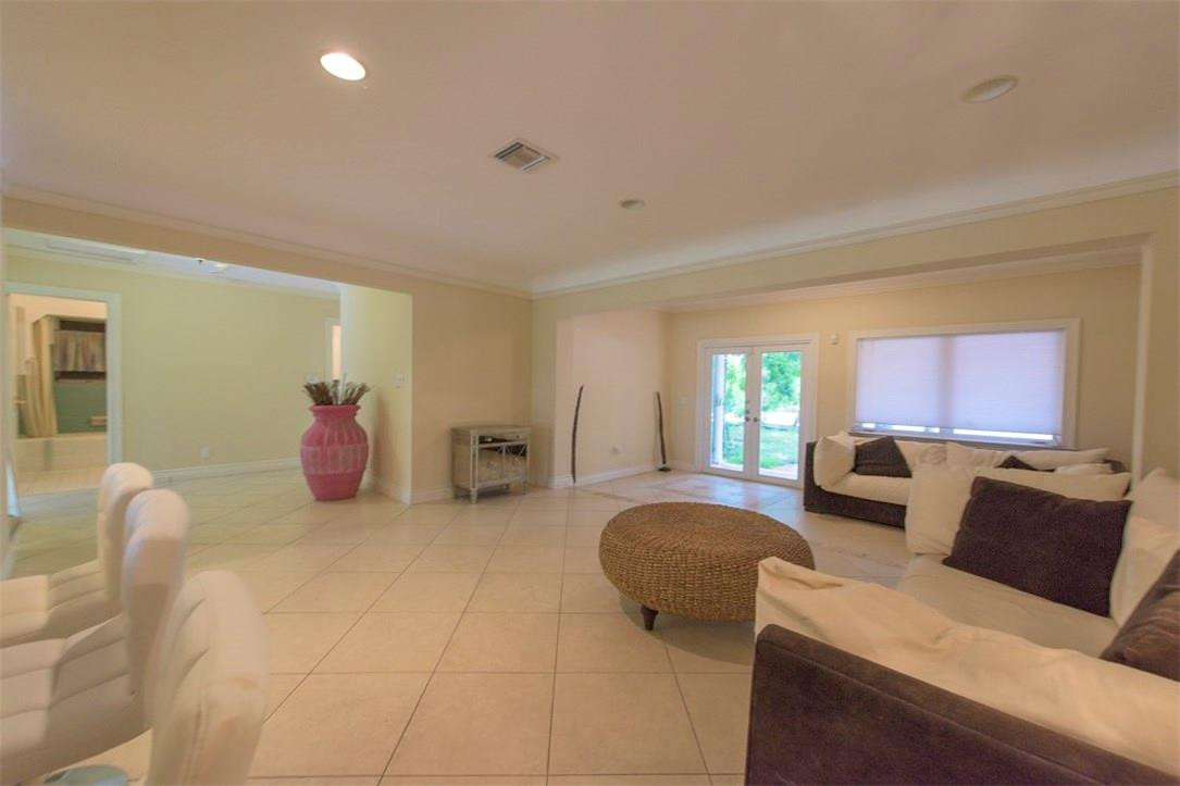 3405 Leigh Road Pompano Beach, FL 33062 - Photo 3 of 35 a living room with furniture and a window
