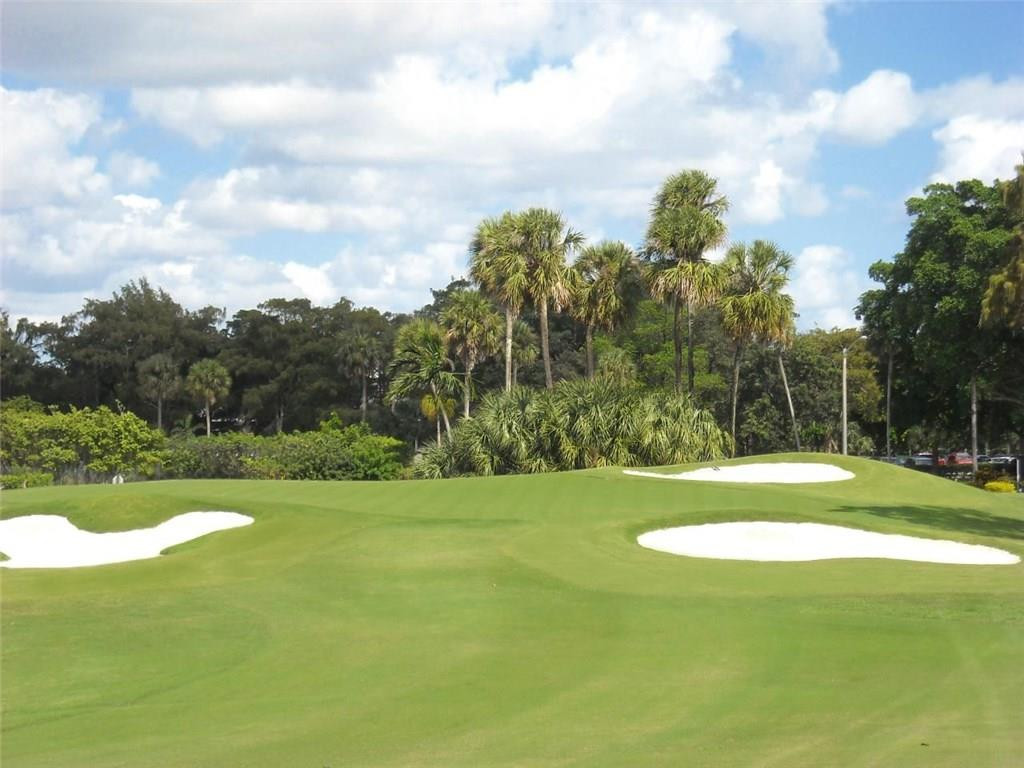 3405 Leigh Road Pompano Beach, FL 33062 - Photo 31 of 35 a view of a golf course with a garden