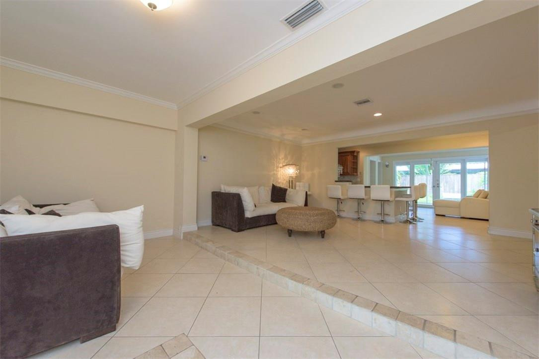 3405 Leigh Road Pompano Beach, FL 33062 - Photo 4 of 35 a living room with furniture and a dining table with wooden floor