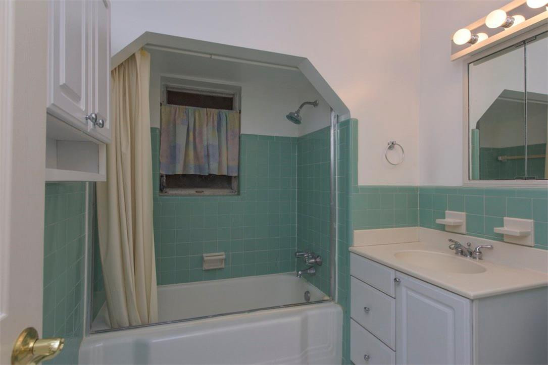 3405 Leigh Road Pompano Beach, FL 33062 - Photo 10 of 35 a bathroom with a sink and a mirror