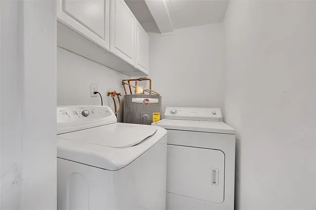 a bathroom with a shower and a sink