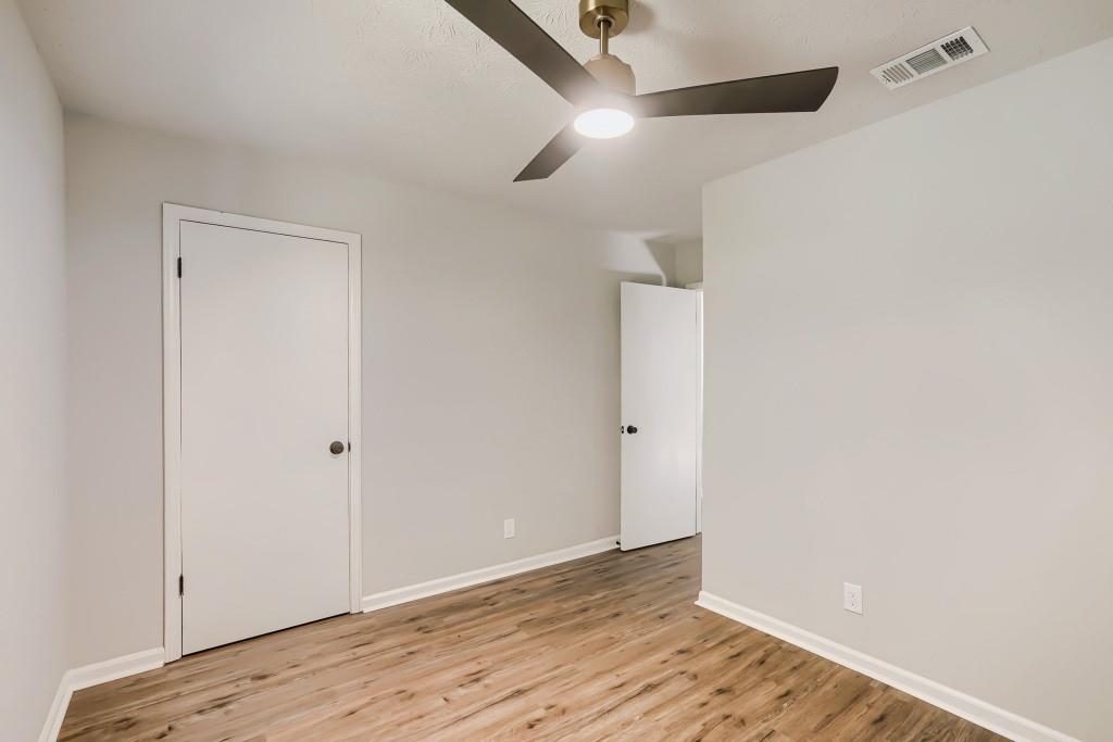 2021 Irwin Bridge Road Northwest Conyers, GA 30012 - Photo 33 of 43 a view of an empty room with wooden floor