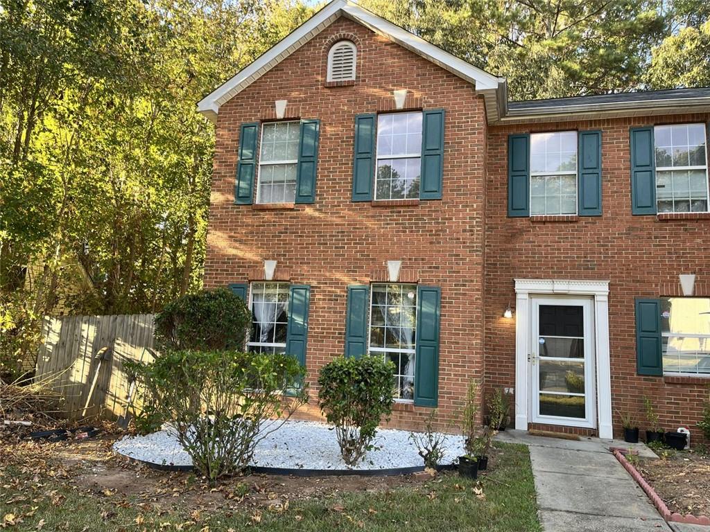 800 Sinclair Way Jonesboro, GA 30238 - Photo 2 of 10 a front view of a house with a yard