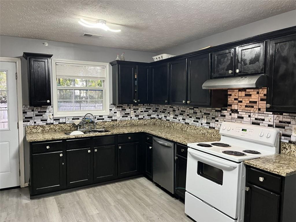800 Sinclair Way Jonesboro, GA 30238 - Photo 3 of 10 a kitchen with sink cabinets and window