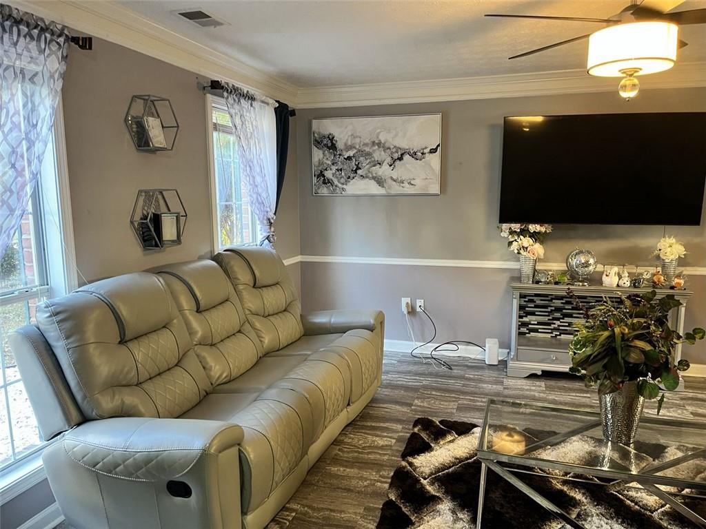 800 Sinclair Way Jonesboro, GA 30238 - Photo 4 of 10 a living room with furniture and a flat screen tv