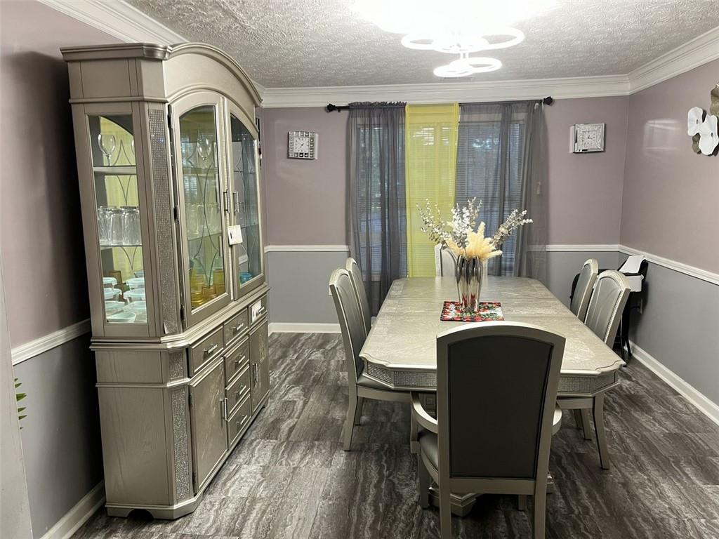 800 Sinclair Way Jonesboro, GA 30238 - Photo 7 of 10 a view of a dining room with furniture window and wooden floor