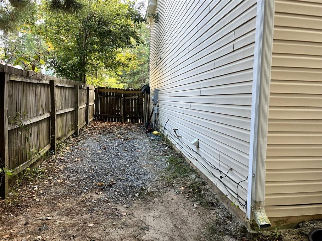 800 Sinclair Way Jonesboro, GA 30238 - Photo 9 of 10 a view of a backyard with wooden fence