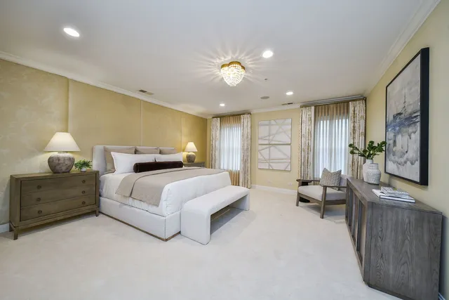 a spacious bedroom with a bed and furniture