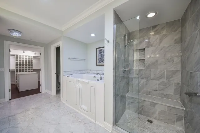a bathroom with a shower a sink and a mirror