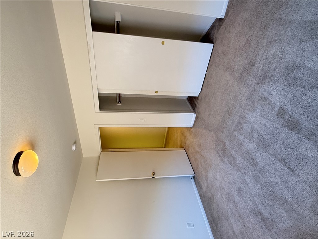 8108 Roundup Ridge Street Las Vegas, NV 89131 - Photo 15 of 21 Plush carpeting and convenient closet access define this inviting private space.