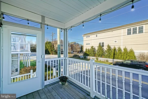 a view of a porch with wooden floor
