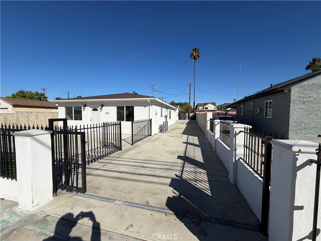 16822 Randall Avenue, Unit 2 Fontana, CA 92335 - Photo 16 of 17 driveway to back house