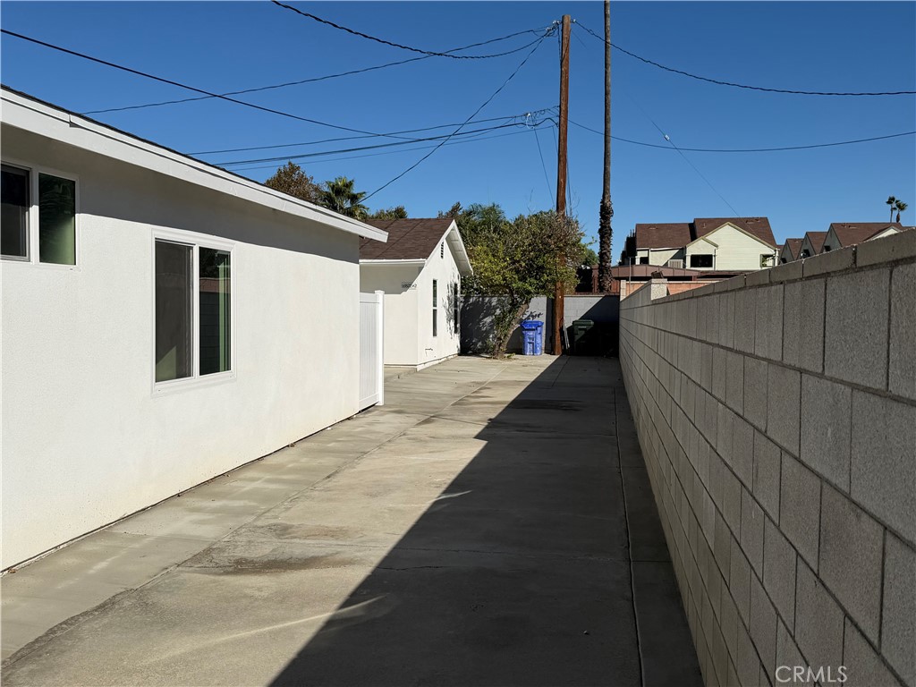 16822 Randall Avenue, Unit 2 Fontana, CA 92335 - Photo 17 of 17 driveway to back house