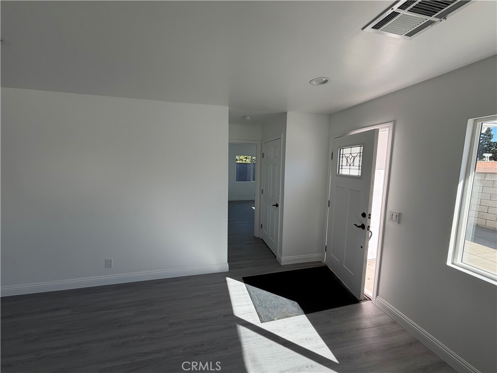 16822 Randall Avenue, Unit 2 Fontana, CA 92335 - Photo 5 of 17 hallway to laundry closet and primary suite