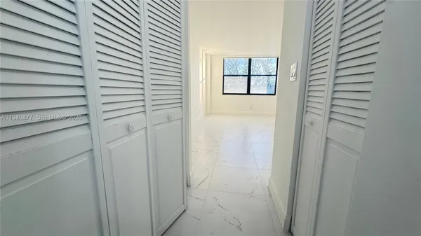 a bathroom with a toilet sink and vanity