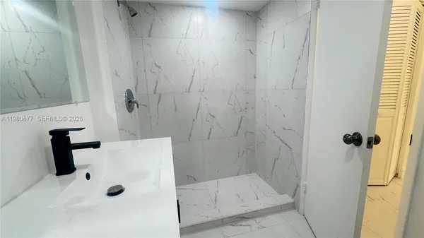 a bathroom with a toilet sink and vanity