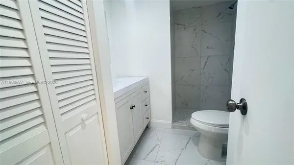 a view of a backyard with sitting area