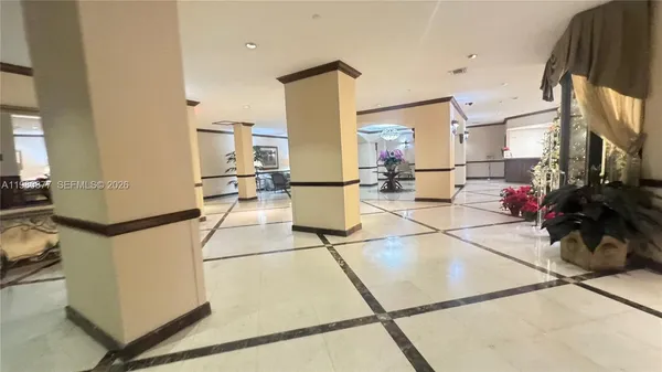 a view of a living room and a balcony