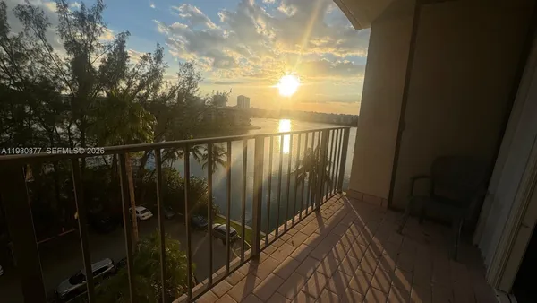 a view of balcony with wooden floor
