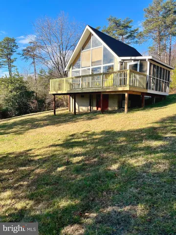 a front view of a house with a boat