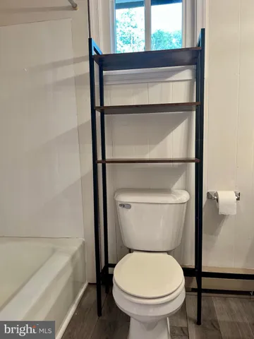 a view of porch with wooden floor