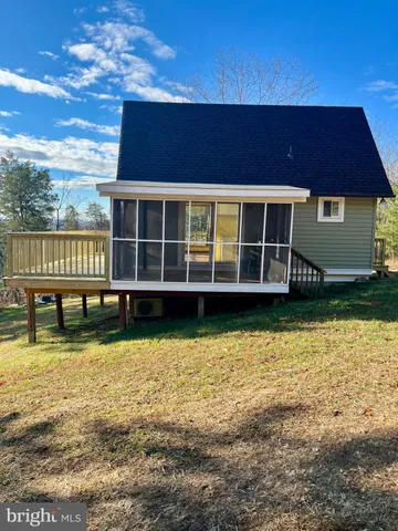 a house with swimming pool in front of it