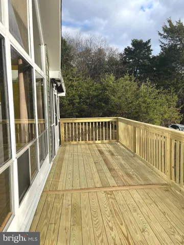 a view of balcony with wooden floor