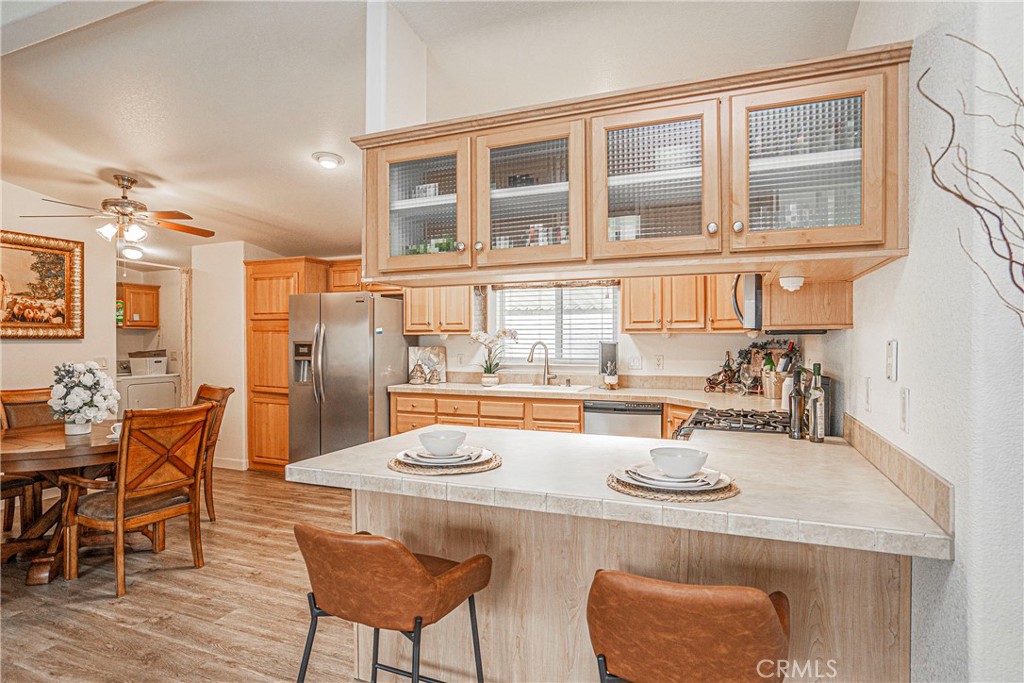 a kitchen with a dining table and chairs