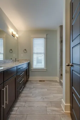 a bathroom with a sink double vanity and a mirror