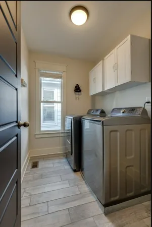 a kitchen with stainless steel appliances granite countertop a refrigerator and a stove