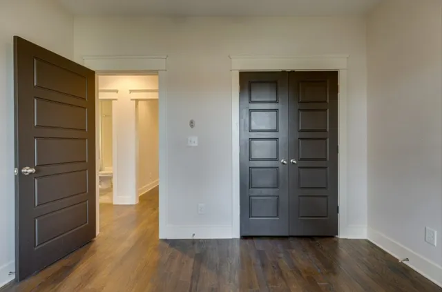 a view of walk in closet with empty racks