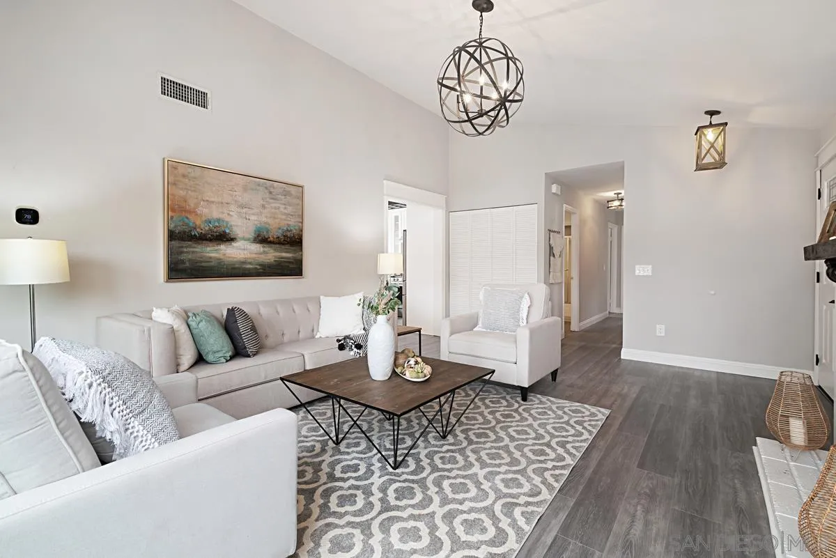 13356 Racquet Court Poway, CA 92064 - Photo 3 of 21 a living room with furniture or couch and a chandelier
