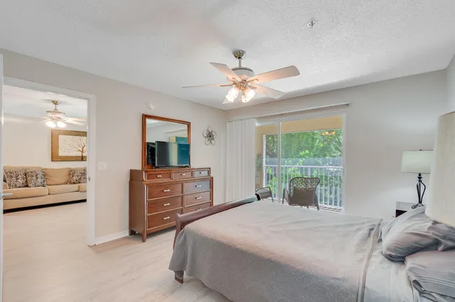 a bedroom with a bed and a lamp