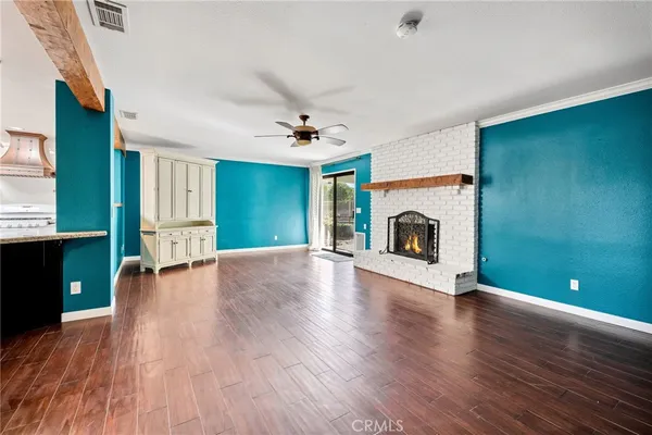 a view of livingroom with hardwood floor and a ceiling fan