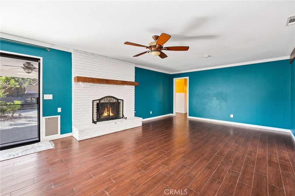 26655 Del Rosa Drive Hemet, CA 92544 - Photo 14 of 57 a view of empty room with wooden floor and fan