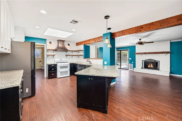 a kitchen with a sink and a stove top oven