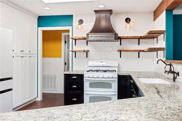 a spacious bathroom with a double vanity sink and a mirror