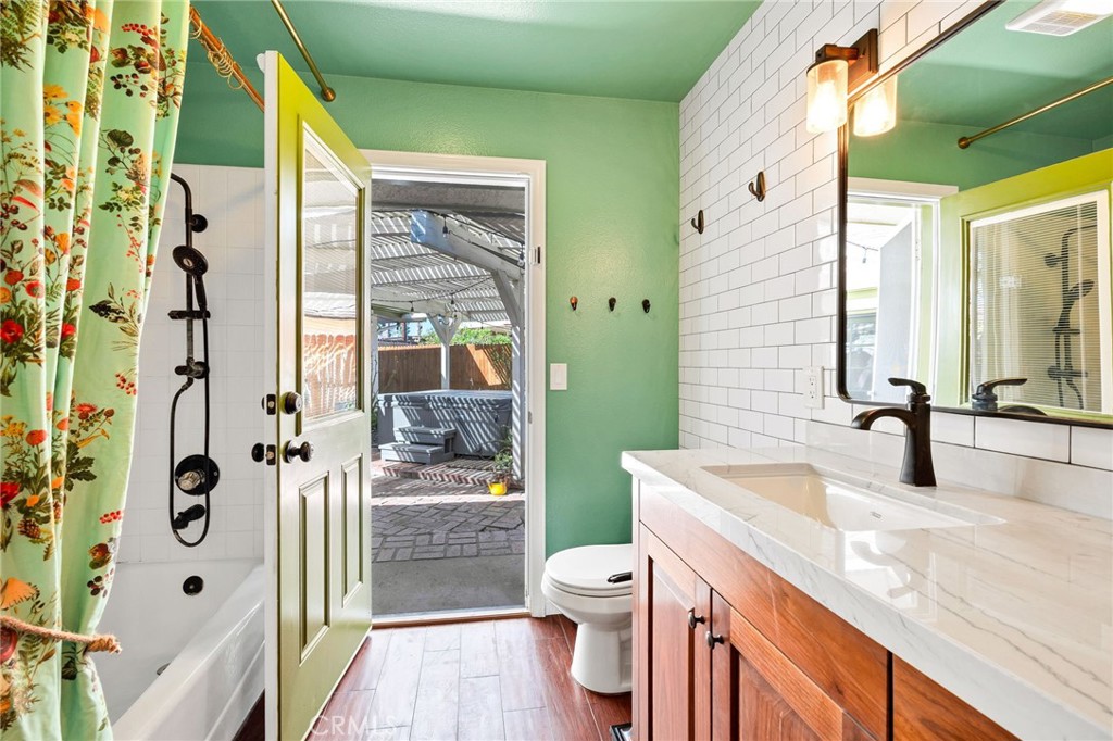 26655 Del Rosa Drive Hemet, CA 92544 - Photo 23 of 57 a bathroom with a granite countertop sink mirror vanity and toilet