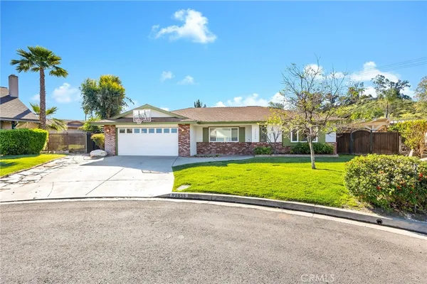 a view of house with outdoor space and swimming pool