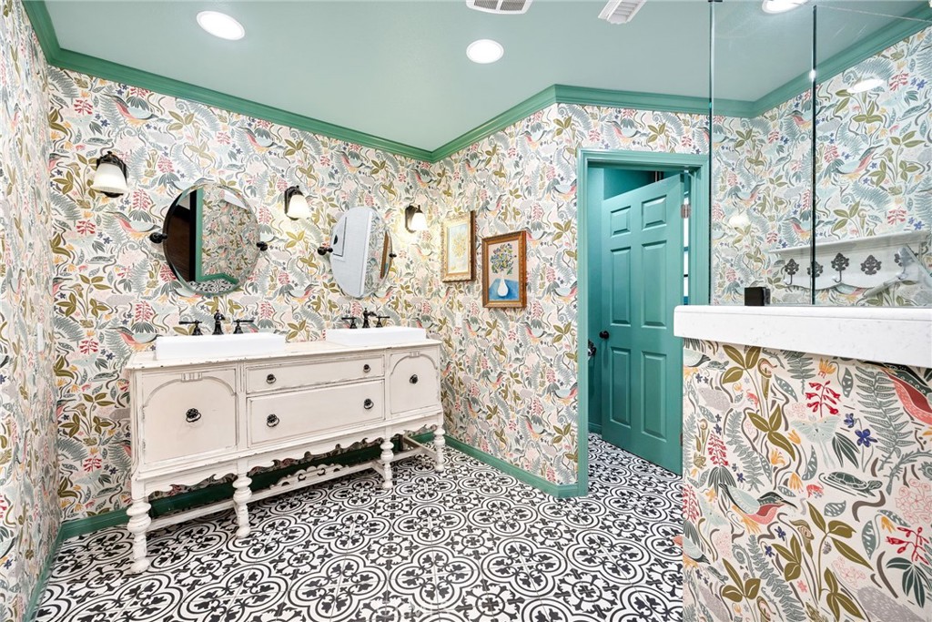 26655 Del Rosa Drive Hemet, CA 92544 - Photo 34 of 57 a bathroom with a double vanity sink mirror and shower