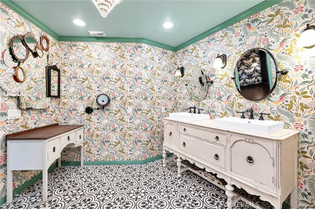 26655 Del Rosa Drive Hemet, CA 92544 - Photo 36 of 57 a bathroom with a sink and a mirror