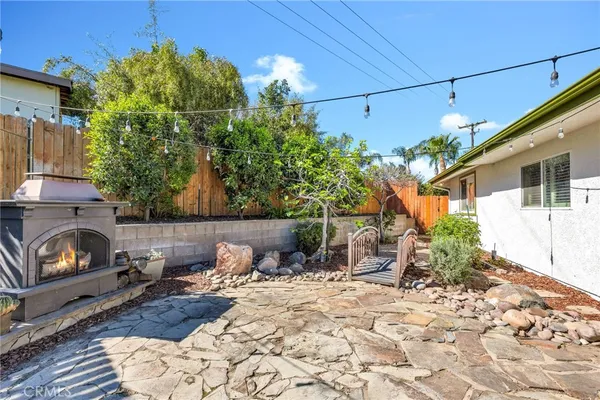 a swimming pool with outdoor seating and yard