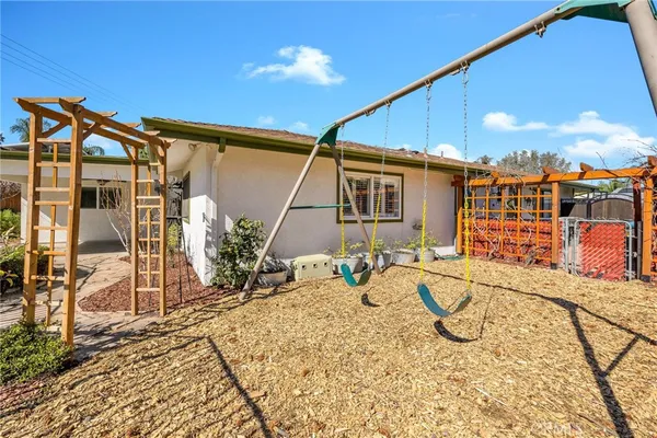 a view of a swimming pool with a patio